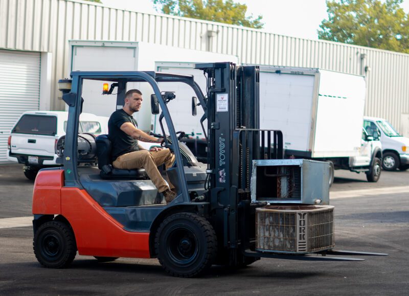 Owner Moving AC Gear at shop